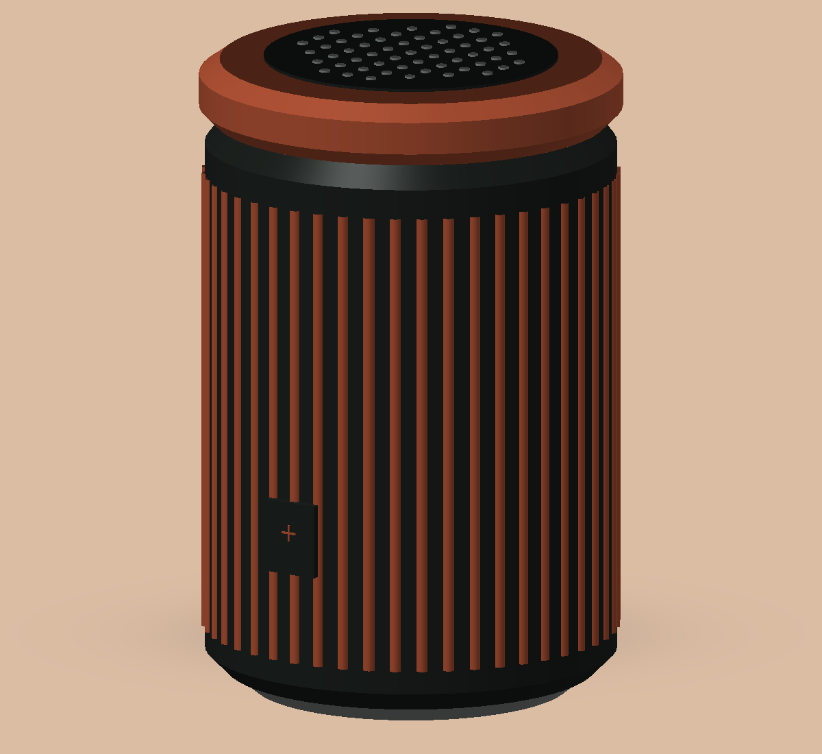 Terracottakleurige cilindervormige speaker met verticale ribben en een donkere geperforeerde bovenkant.
